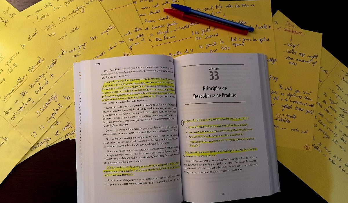 Handwritten study notes on product discovery beside an open copy of Inspired, on product-discovery principles